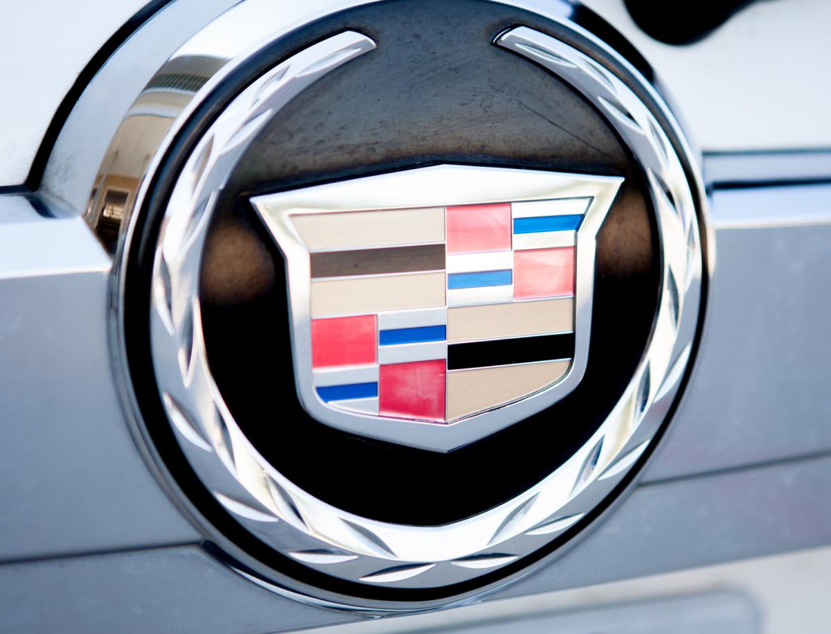 A closeup look at the logo of cadillac cars with chrome shining