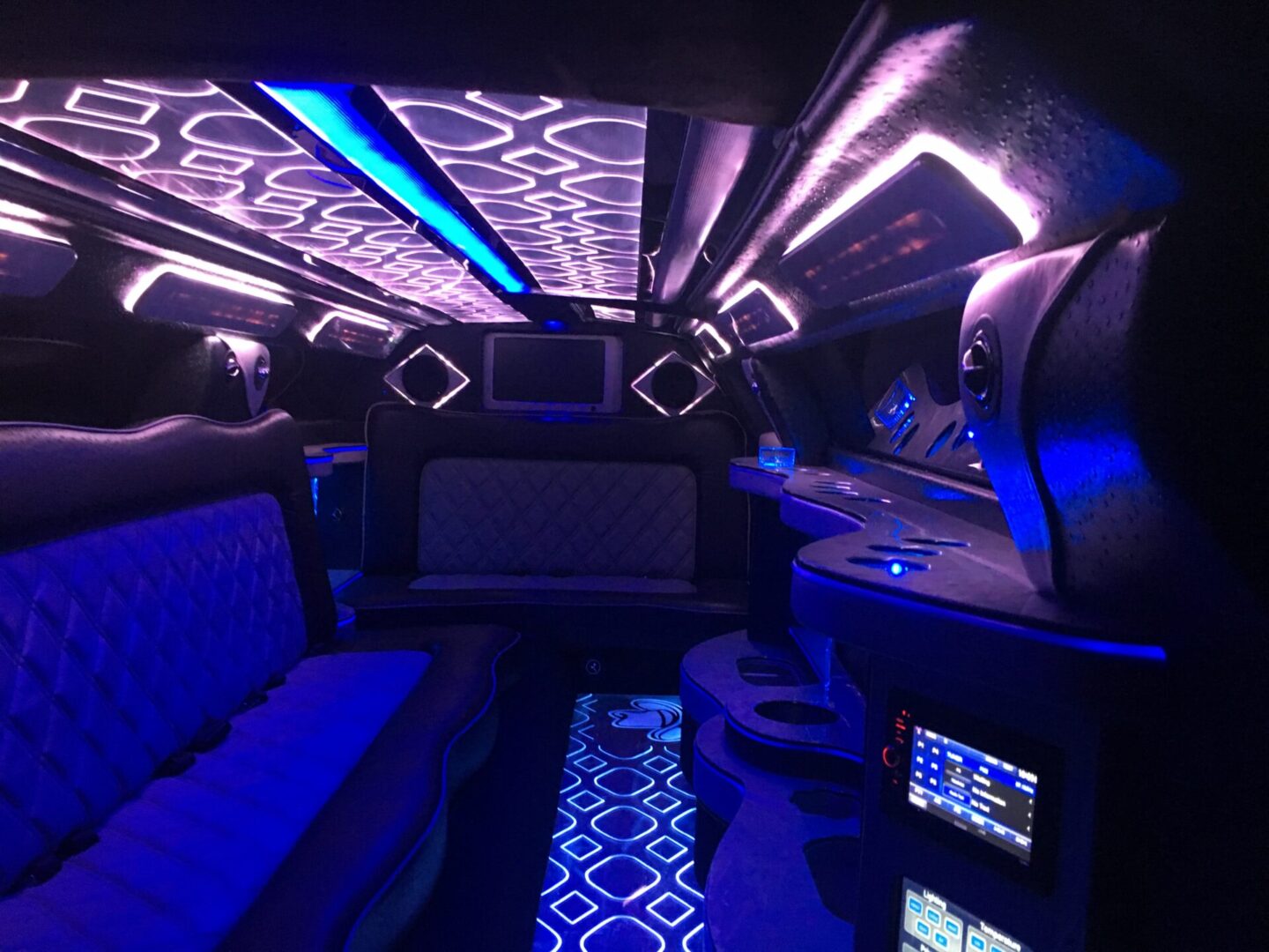 Blue lit interior of a limousine.